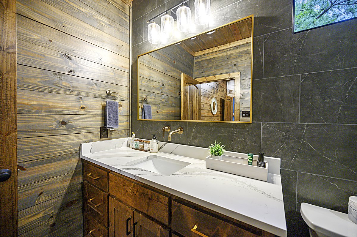 Bathroom vanity with dark tile