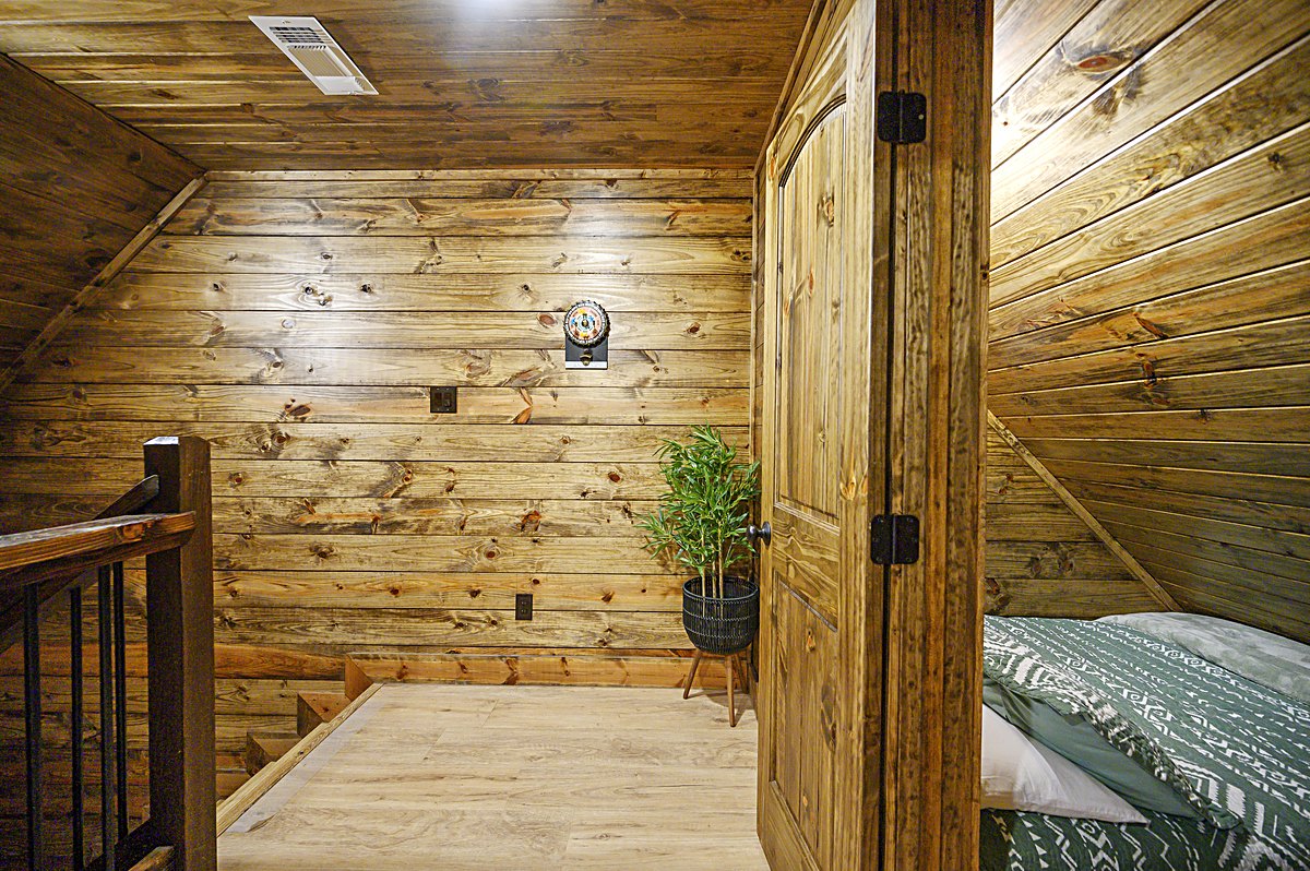 Loft landing with wood walls